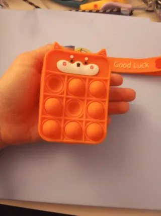 Monedero Naranja Gato Pop-it Suerte