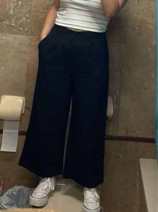 Pantalón de pinzas negro mujer