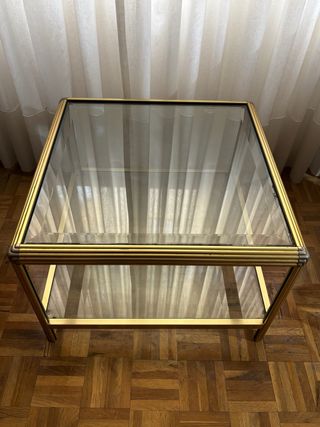 Mesa centro cristal y metal dorado