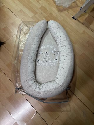 Cojín reductor bebé león