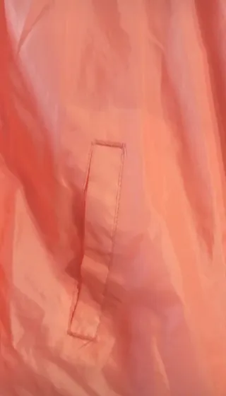 Chubasquero cortavientos naranja/rosa