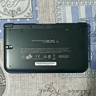 Nintendo 3DS XL + base ricarica + giochi