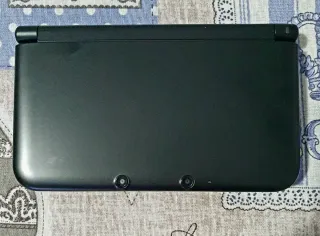 Nintendo 3DS XL + base ricarica + giochi
