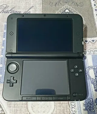 Nintendo 3DS XL + base ricarica + giochi