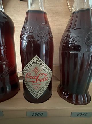 Collezione bottiglie Coca Cola