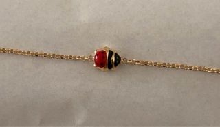 Bracciale oro 18 KT con coccinella rossa