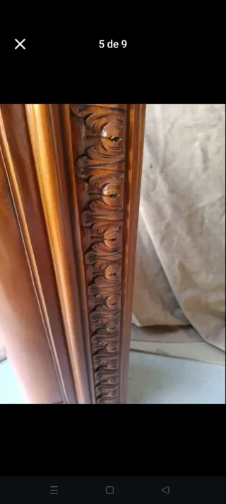 Chimenea de madera tallada con mármol