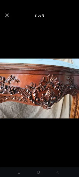 Chimenea de madera tallada con mármol