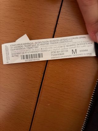 Bolso Stradivarius brillos negro y plata