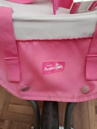 Carro gemelar de juguete rosa