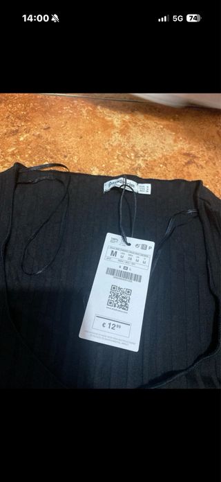 Top negro manga por el codo