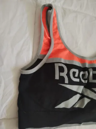 Sujetador deportivo Reebok negro y naranja