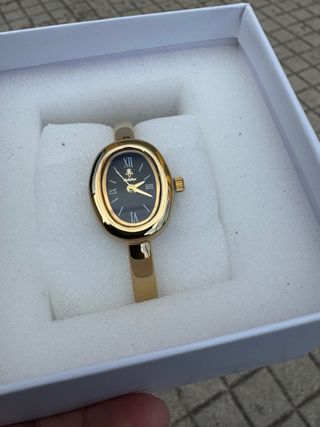 Orologio elegante nero e oro