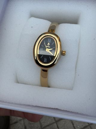 Orologio elegante nero e oro