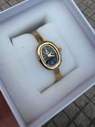 Orologio elegante nero e oro