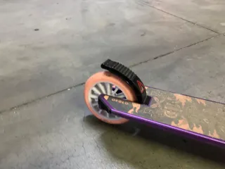 Patinete Oxelo Mid5 morado plegable