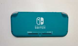 Nintendo Switch Lite + caricabatterie + accessori