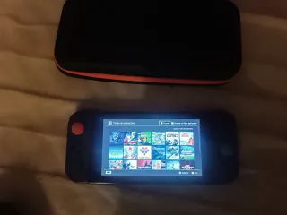 Nintendo Switch con funda, cargador y juegos y RCM