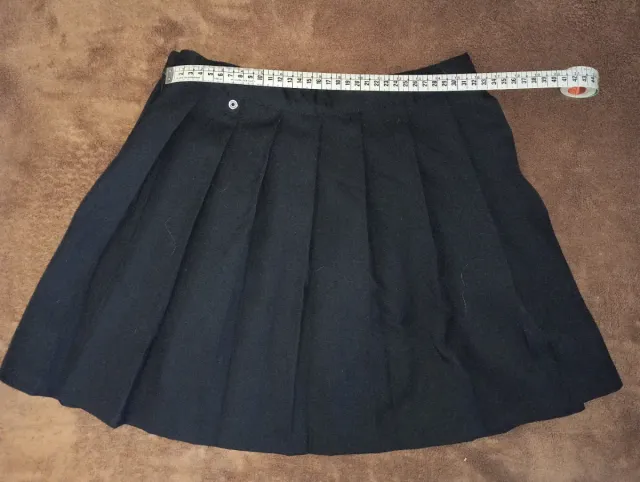 Falda H&M negra de tablas. 11-12 años.