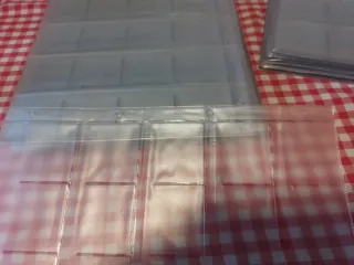 50 Hojas plástico sellos/monedas.