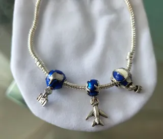 Pulsera viajero con 3 charms