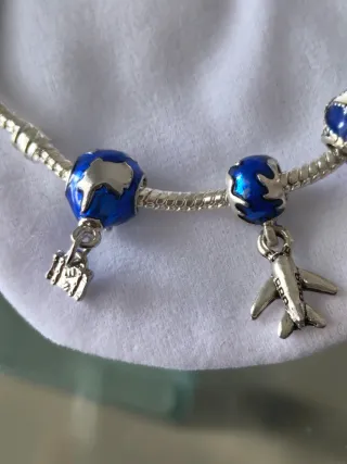 Pulsera viajero con 3 charms