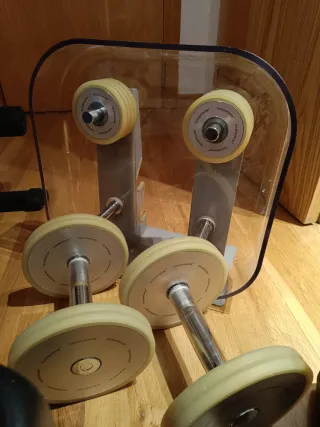 Banco de pesas + mancuernas y discos