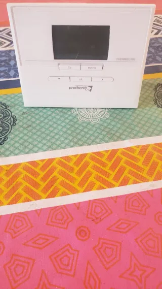 Sillones de piel marrones (2 unidades) y caldera