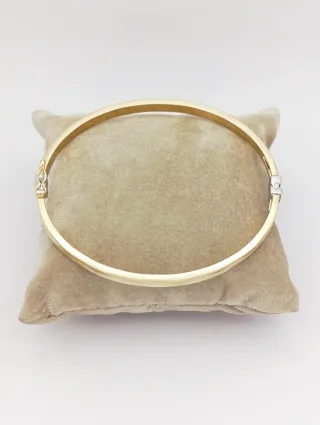 Pulsera rígida en Oro 18k con diseño ondulado.