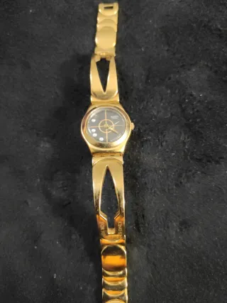 Reloj Swatch Dorado y Negro