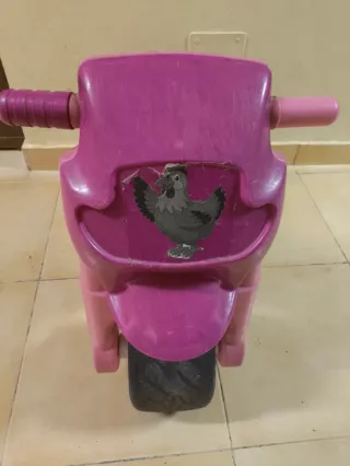 Moto infantil de plástico rosa y morado