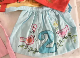 Accessori My Doll: grembiulini numerati