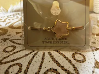 Pulsera estrella acero inoxidable i pendientes.
