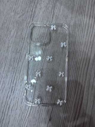 Funda transparente con brillos y lazos