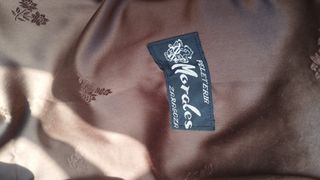 Abrigo de piel beige y marrón