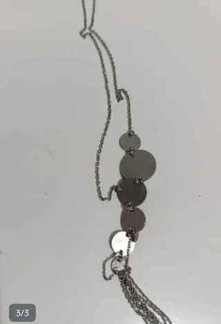 Collar plateado con discos y flecos