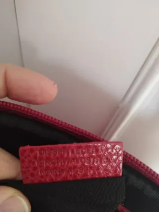 Bolso de mano rojo Dissel.