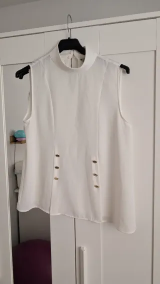 Blusa blanca sin mangas con cuello alto M mujer
