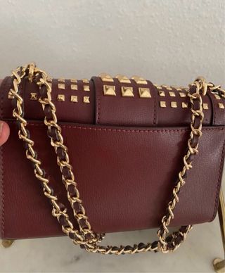 Bolso Michael Kors con tachuelas doradas