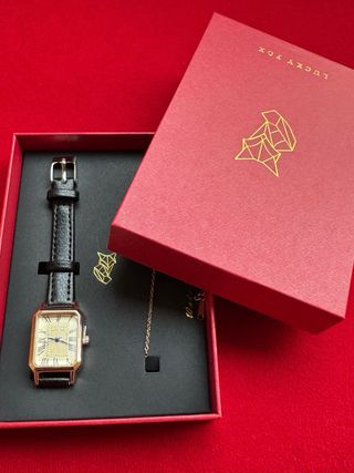 Orologio elegante nero e oro