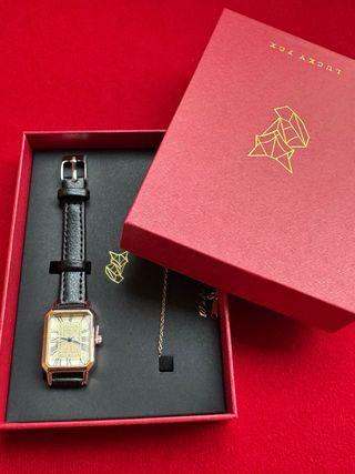 Orologio elegante nero e oro