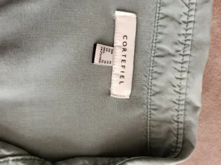 Camisa verde caqui Cortefiel de mujer