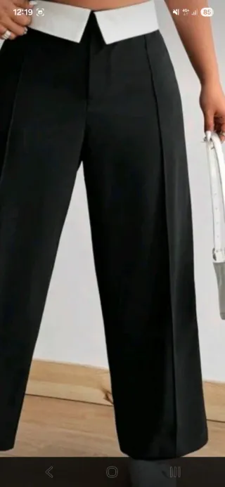 Traje de pantalón negro y blanco