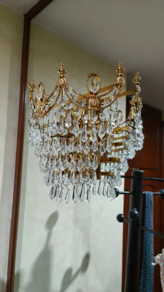 Apliques de pared de cristal y metal dorados