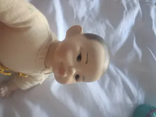 Muñeco oriental de porcelana