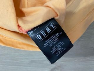 Camiseta GRMY degradado rosa y naranja