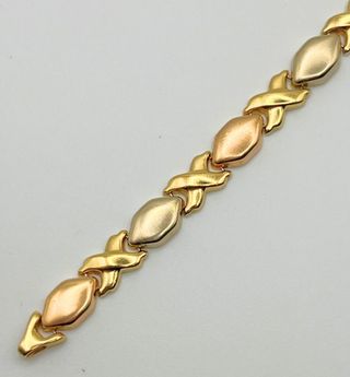 Pulsera fantasía oro combinado 18k. Peso: 10.78 gr