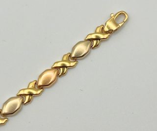 Pulsera fantasía oro combinado 18k. Peso: 10.78 gr