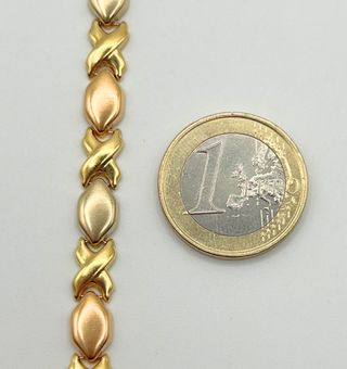 Pulsera fantasía oro combinado 18k. Peso: 10.78 gr