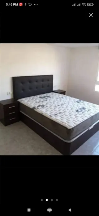 Cama canapé tapizada cuero y madera